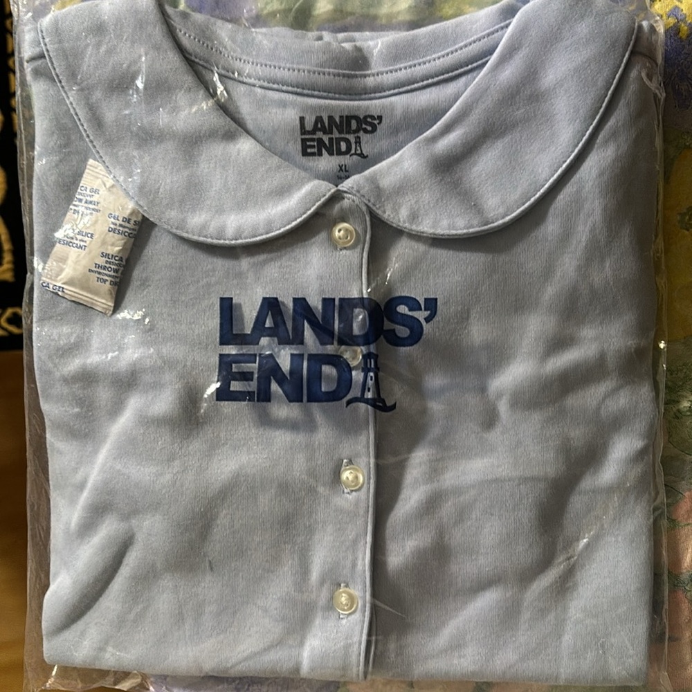 Lands end girls shirt size S/p (7-8), M (10-12), or XL (14-16). Light blue